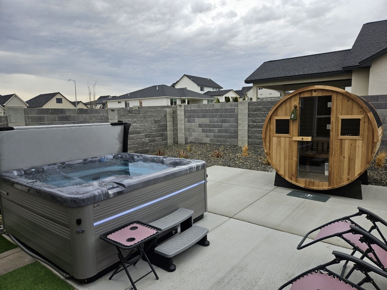 Customer backyard with Vita Spa hot tub and Redwood Outdoors barrel sauna delivered by AquaZen in Tri-Cities WA