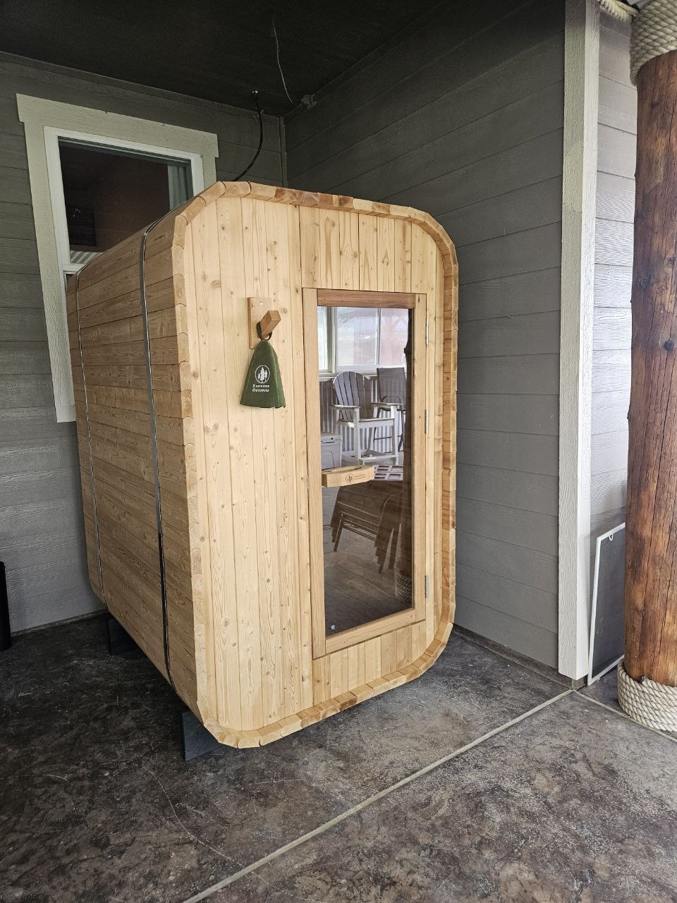 Redwood Outdoors cube sauna installed on covered patio — delivered by AquaZen Pool Spa Sauna in Tri-Cities WA