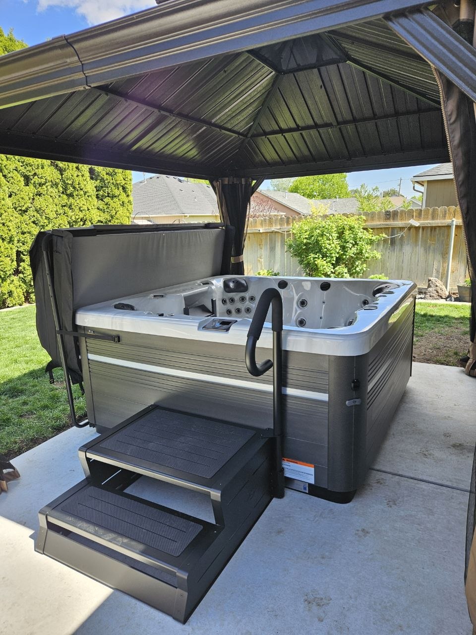 Vita Spa hot tub delivered and installed under gazebo in Tri-Cities WA backyard by AquaZen Pool Spa Sauna