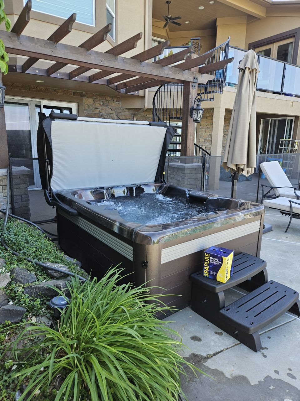 Vita Spa 100 Series 110V hot tub delivered and installed under pergola in Tri-Cities WA by AquaZen Pool Spa Sauna