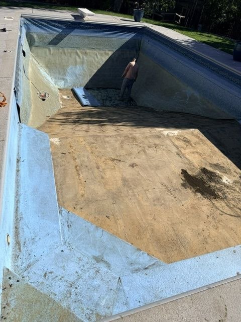 Before: old torn pool liner being removed — AquaZen pool liner replacement Tri-Cities WA