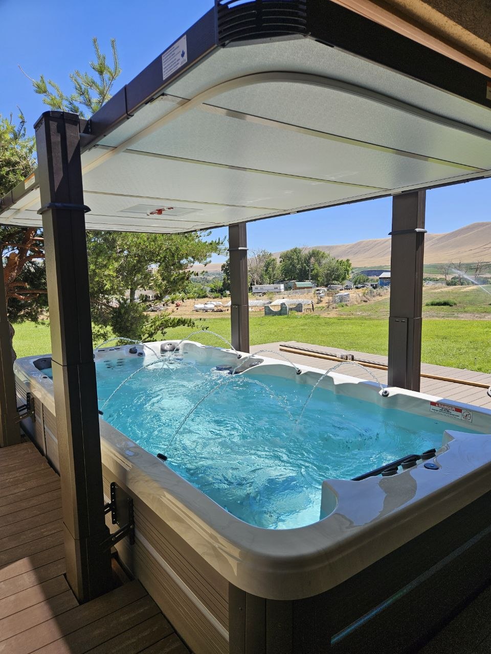 Vita Spa with water features on cedar deck under pergola, Eastern WA hills — AquaZen Tri-Cities WA
